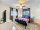 This main bedroom offers a ceiling fan, two windows, and a cozy area rug at 702 E Church St # 3, Orlando, FL 32801