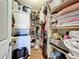 Walk-in closet includes washer, dryer, shelves, clothes and organizers at 702 E Church St # 3, Orlando, FL 32801