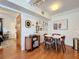Bright dining area features wood floors, decor wall, and round table with seating for four at 702 E Church St # 3, Orlando, FL 32801