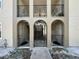 A view of the condo's entrances featuring a wrought iron gate and beautiful archways at 702 E Church St # 3, Orlando, FL 32801