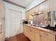 The kitchen area features wood cabinets, granite countertops, and a stainless steel sink at 702 E Church St # 3, Orlando, FL 32801