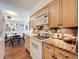 This lovely kitchen offers wood cabinets, granite countertops, mosaic tile backsplash, and eating area at 702 E Church St # 3, Orlando, FL 32801