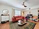A cozy living room with wood floors, a seating area, a desk, and lots of sunlight at 702 E Church St # 3, Orlando, FL 32801