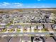 From above, discover a scenic community surrounded by nature with modern homes, lawns and wetlands views at 7649 Ragusa Way, Clermont, FL 34714
