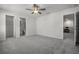 Bedroom with adjacent bathroom and sitting area at 7649 Ragusa Way, Clermont, FL 34714