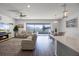 Bright and open living area with modern furnishings and a view of the lanai at 7649 Ragusa Way, Clermont, FL 34714