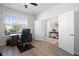 Spacious office with wood floors, natural light from the window, double doors and neutral paint at 7649 Ragusa Way, Clermont, FL 34714