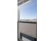 A window showing a clear view of the sky and other rooftops at 7649 Ragusa Way, Clermont, FL 34714