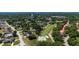 The aerial view features a golf course community with views of mature trees and a water tower at 7655 Persian Ct, Orlando, FL 32819