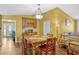 Bright dining room featuring hardwood floors, modern lighting, and a built-in bar area at 7655 Persian Ct, Orlando, FL 32819