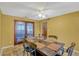The dining room is adjacent to the kitchen and features backyard views and space to gather at 7655 Persian Ct, Orlando, FL 32819