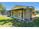 Rear view of the home showing access to the screened in pool area from multiple rooms via french doors at 7655 Persian Ct, Orlando, FL 32819