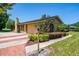 This home is highlighted with manicured landscaping, a brick paver driveway and a side entry garage at 7655 Persian Ct, Orlando, FL 32819