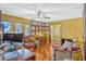 Spacious office featuring natural light, hardwood flooring and custom cabinets and furnishings at 7655 Persian Ct, Orlando, FL 32819