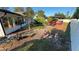 Serene backyard featuring a charming gazebo, paved walkway, and well-kept landscaping at 7730 Broken Arrow Trl, Winter Park, FL 32792
