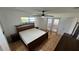 Bedroom with fan, light, furniture, and doors leading to an outdoor area at 7730 Broken Arrow Trl, Winter Park, FL 32792