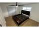 Bedroom featuring a window, ceiling fan, and a modern bed frame at 7730 Broken Arrow Trl, Winter Park, FL 32792