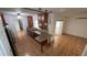 Updated kitchen featuring granite countertops, wooden cabinets, and modern lighting at 7730 Broken Arrow Trl, Winter Park, FL 32792