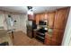 Modern kitchen with stainless steel appliances, ample counter space, and wooden cabinets at 7730 Broken Arrow Trl, Winter Park, FL 32792