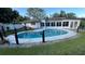 Backyard with a large inground pool perfect for outdoor entertaining and relaxation at 7730 Broken Arrow Trl, Winter Park, FL 32792