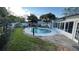 Backyard pool is surrounded by well-maintained landscaping and a privacy fence at 7730 Broken Arrow Trl, Winter Park, FL 32792