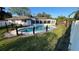 A private backyard oasis features an in-ground pool and well-maintained landscaping at 7730 Broken Arrow Trl, Winter Park, FL 32792