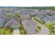 Gorgeous community with manicured lawns, solar panels, mature trees, and expertly planned home placement at 7831 Dausset St, Orlando, FL 32827