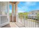 Enjoy the view from this covered balcony with tile flooring and railing at 7831 Dausset St, Orlando, FL 32827