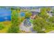 Aerial view of the community featuring a lake, a unique structure, and inviting outdoor gathering spots at 7831 Dausset St, Orlando, FL 32827