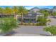 Modern fitness center with large windows surrounded by lush landscaping, offering a refreshing and bright workout environment at 7831 Dausset St, Orlando, FL 32827