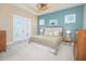 Comfortable main bedroom with ceiling fan, carpeted floors, and access to a private balcony at 7831 Dausset St, Orlando, FL 32827