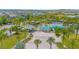 This fantastic aerial view highlights the community pool, sand volleyball court, and meticulously landscaped grounds at 7831 Dausset St, Orlando, FL 32827