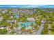 Resort-style pool area with palm trees, lounge chairs, and a splash zone, perfect for relaxation and Gathering fun at 7831 Dausset St, Orlando, FL 32827