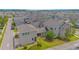 Aerial view showcases the property's layout with a view of the rear and side yards, as well as neighborhood streets at 7831 Dausset St, Orlando, FL 32827