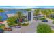 A stylish waterfront restaurant featuring vibrant colors and palm tree landscaping creates an inviting dining experience at 7831 Dausset St, Orlando, FL 32827