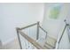 Staircase featuring white railings and hardwood accents, leading to upper levels at 7831 Dausset St, Orlando, FL 32827