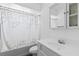 Clean bathroom featuring a bathtub with shower, leaf-patterned shower curtain, and vanity with mirror at 905 Ocala Woods Ln, Orlando, FL 32824