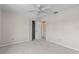 Clean bedroom with ample closet space, soft carpeting, and a ceiling fan for comfort at 905 Ocala Woods Ln, Orlando, FL 32824