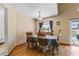 Dining room with wood table and chairs with a view of the backyard at 905 Ocala Woods Ln, Orlando, FL 32824