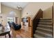 Open living room with hardwood floors, high ceilings, and a staircase leading to the upper level at 905 Ocala Woods Ln, Orlando, FL 32824