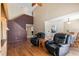 Inviting living room with hardwood floors, high ceilings, and comfortable black leather recliners at 905 Ocala Woods Ln, Orlando, FL 32824