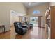 Living room features two leather recliners, hardwood floors, and a sliding door leading to the pool at 905 Ocala Woods Ln, Orlando, FL 32824