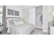 Cozy bedroom features a comfortable bed, closet, and stylish decor at 1048 Teal Creek St, St Cloud, FL 34771
