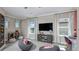 Versatile bonus room with media center and comfortable seating at 1048 Teal Creek St, St Cloud, FL 34771