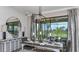 Dining room with seating for six and bright lighting with view of screened lanai at 1048 Teal Creek St, St Cloud, FL 34771