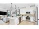 Open-concept kitchen featuring stainless steel appliances and a center island at 1048 Teal Creek St, St Cloud, FL 34771