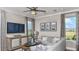 Cozy living room featuring a plush sofa, natural light, and stylish decor at 1048 Teal Creek St, St Cloud, FL 34771