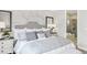 Cozy main bedroom with plush bedding and ensuite bathroom access at 1048 Teal Creek St, St Cloud, FL 34771