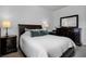 Comfortable bedroom with a large bed, dresser, and soft, neutral bedding at 11014 Hawkshead Ct, Windermere, FL 34786