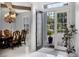Bright foyer with marble floors offering views into the dining room and out to the landscaped front yard at 11014 Hawkshead Ct, Windermere, FL 34786